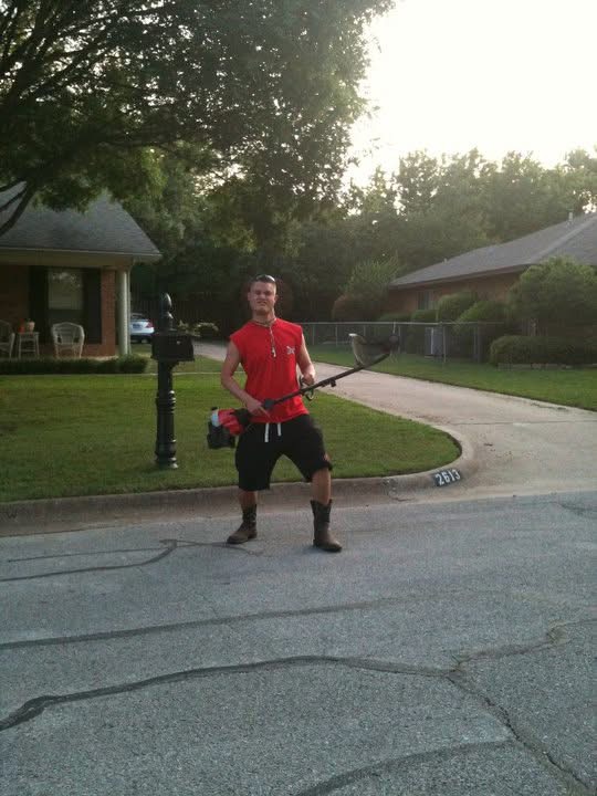 Ryan smiling while doing yard work